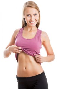 Happy fitness woman shows her belly-img-blog