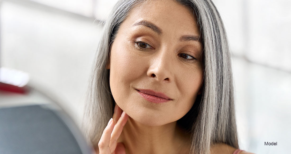 Woman touching her face